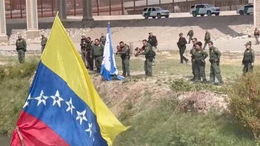 TOTAL CHAOS: Illegal Migrants Waving Giant Venezuelan Flag Attack Border Patrol Agents
