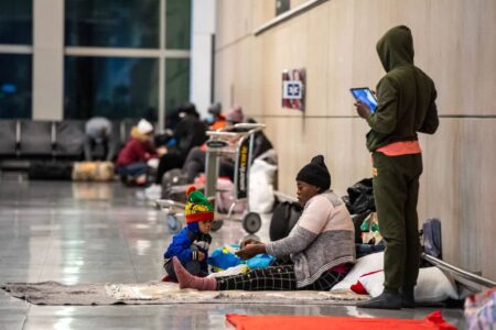Boston airport sheltering migrants in baggage claim with more arriving ‘at all hours’