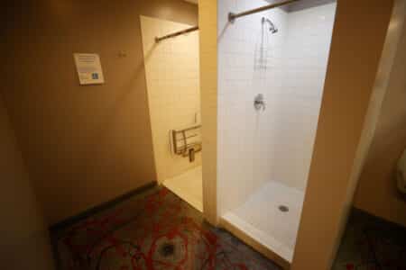 Mother Says She Found Adult Man Showering in Women's Locker Room During Kids' Swim Meet
